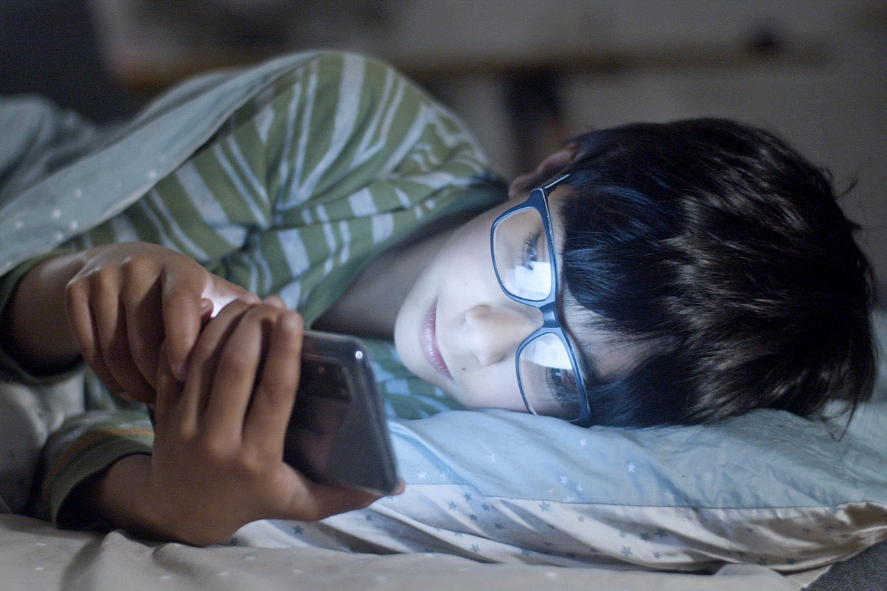 Young person on phone at night